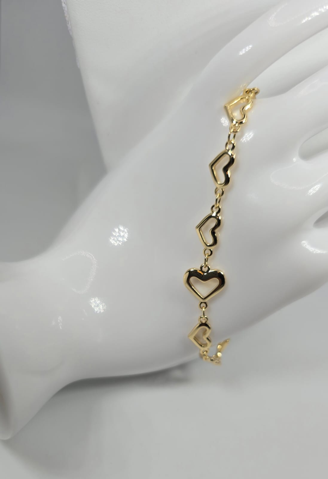 Gold Bracelet with Multiple Hearts
